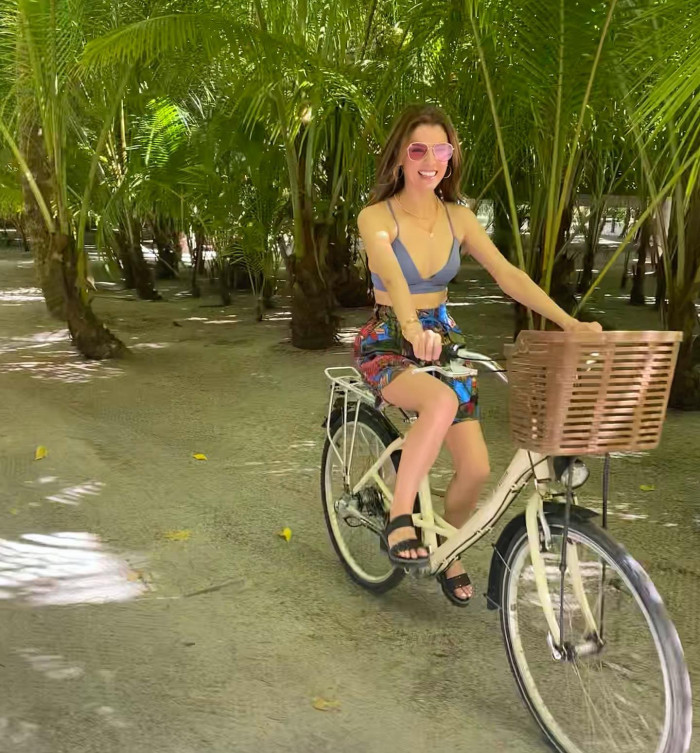 Anna Kendrick Cycling in the Tropical Forest In A Hot Blue Bikini Top And Colorful Shorts